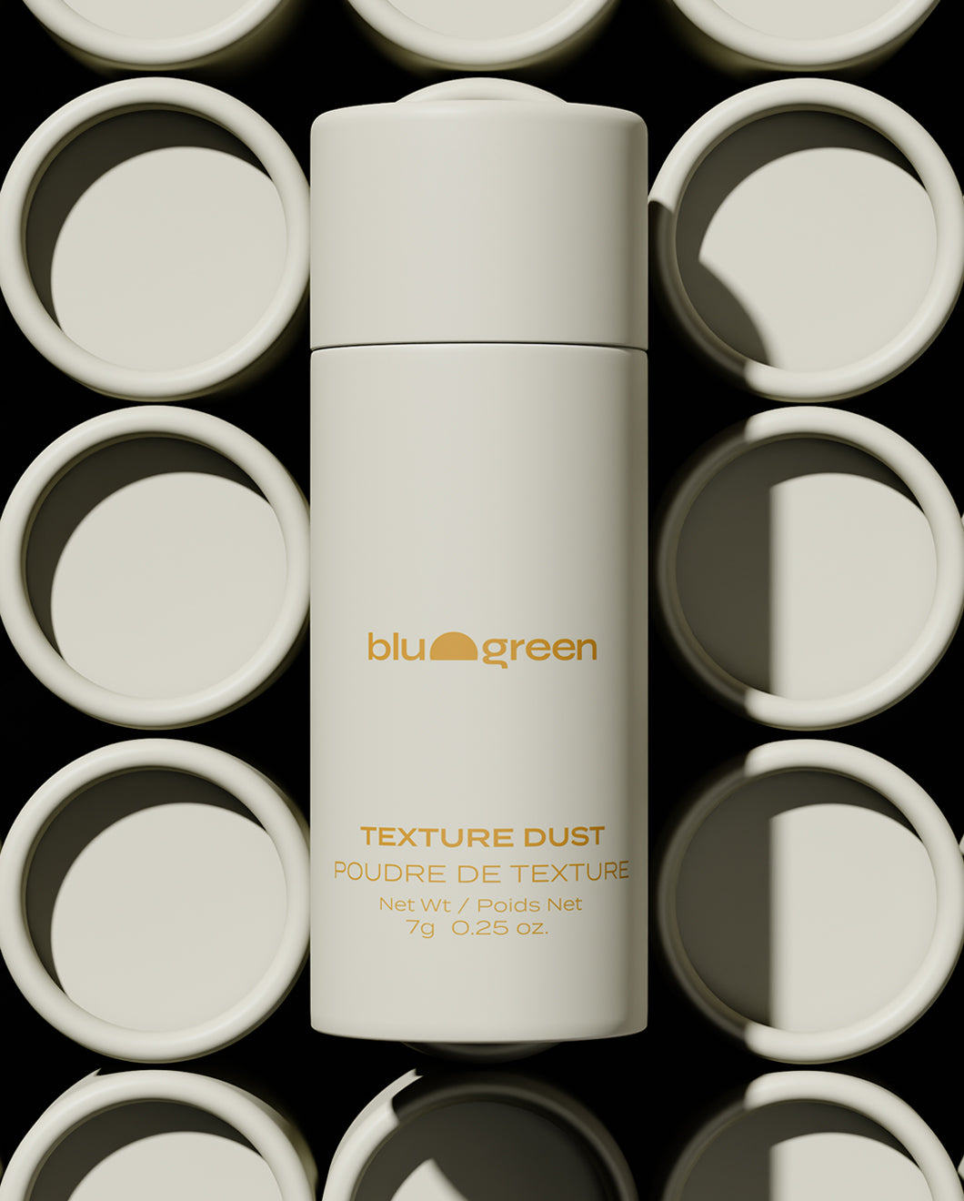 Blu & Green Texture Dust 7g bottle standing upright, centered among circular lids, eco-friendly styling powder packaging.