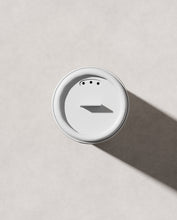 Load image into Gallery viewer, Close-up of Blu & Green Texture Dust shaker cap with three small dispensing holes, eco-friendly hair styling powder.