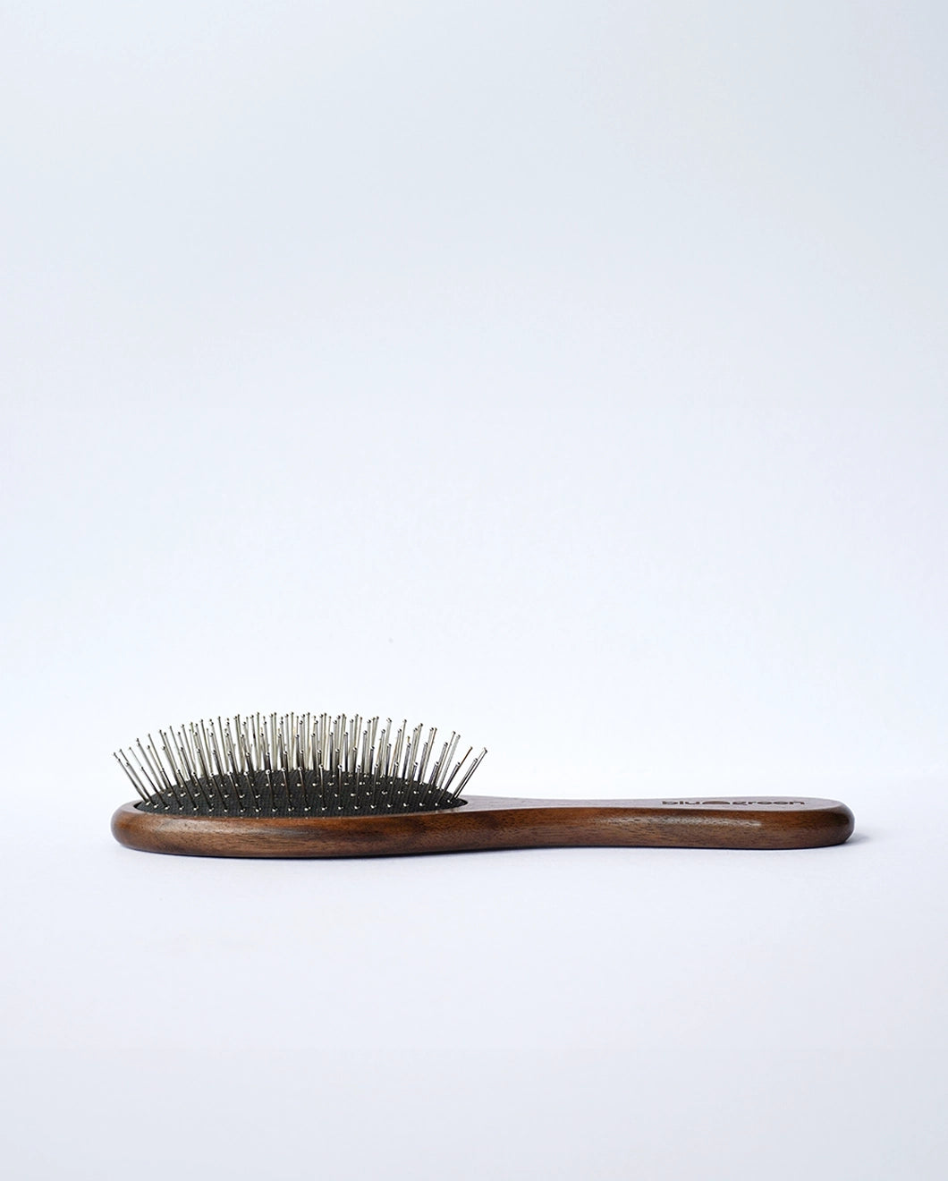 Blu & Green's sustainable Walnut Detangling Brush.