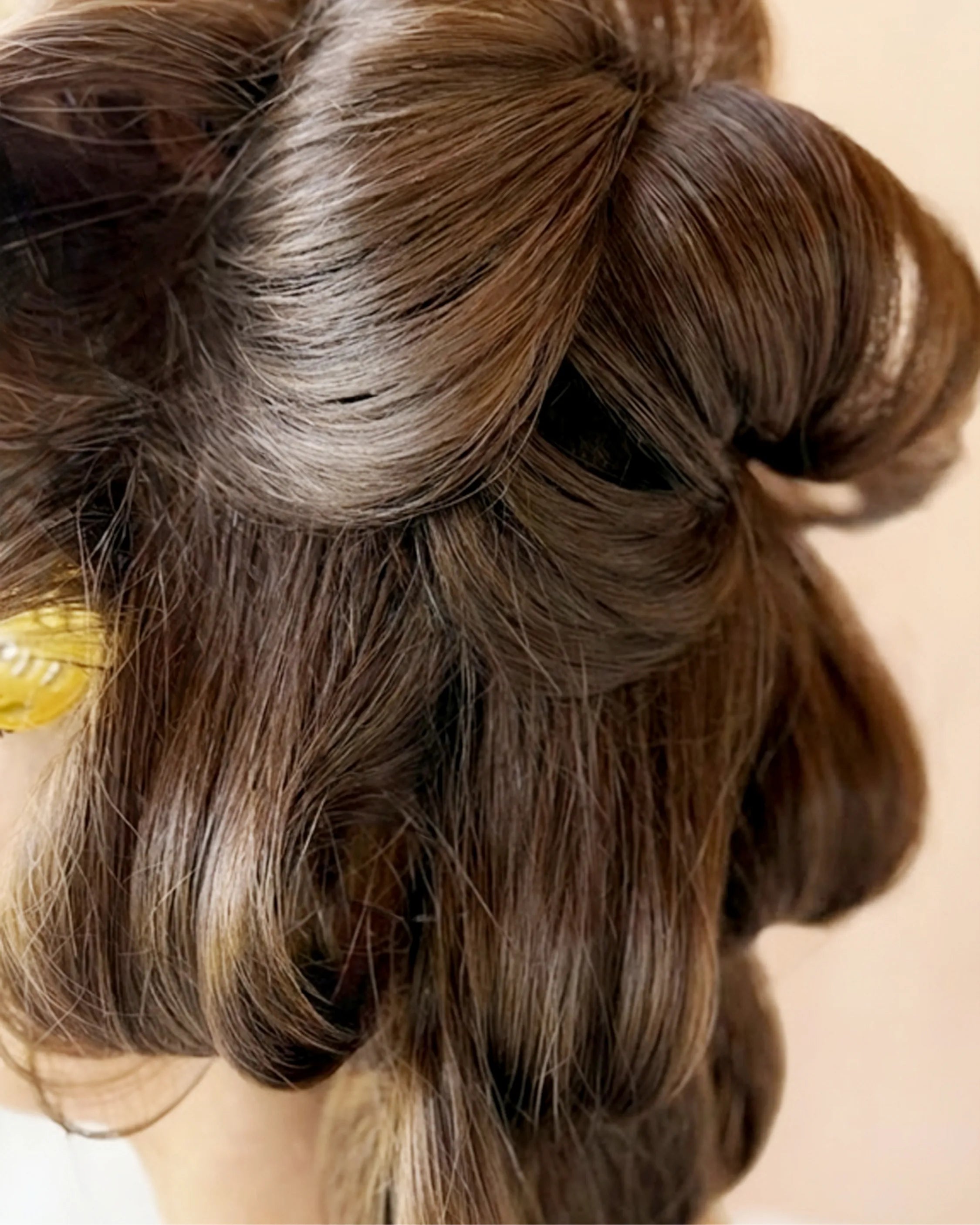 Brown hair with rollers in, being set with Blu & Green Rise & Set Light Styling Cream