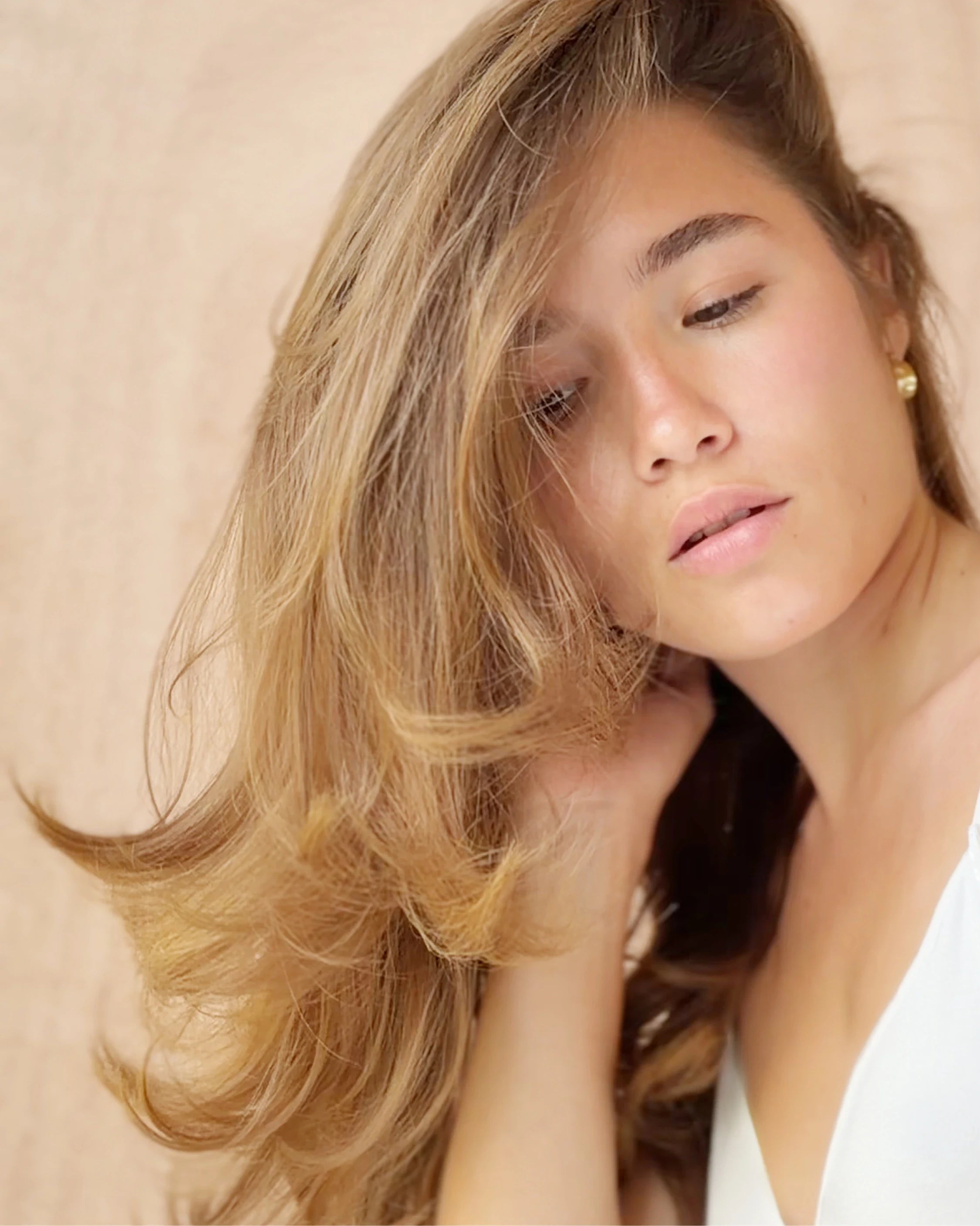 Model with voluminous hair styled with Rise & Set Light Styling Cream
