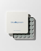 Load image into Gallery viewer, blu and green daily shampoo 50 muted green colored tablets in a flat square tin with blue logo. lid slightly off, studio, white ground, and strong light.
