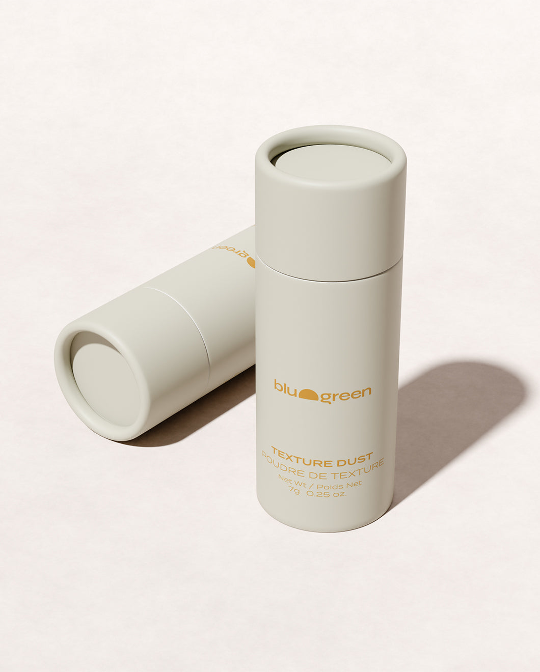 Eco-friendly Blu & Green Texture Dust, one 7g bottle standing upright and one lying flat.