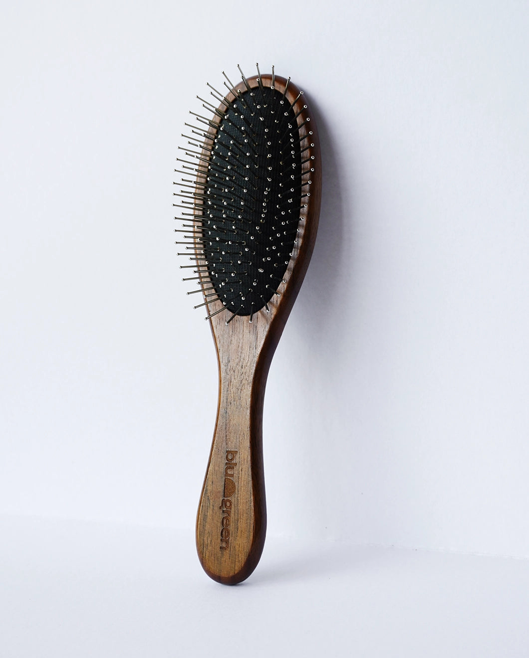 Blu & Green's sustainable Walnut Detangling Brush.