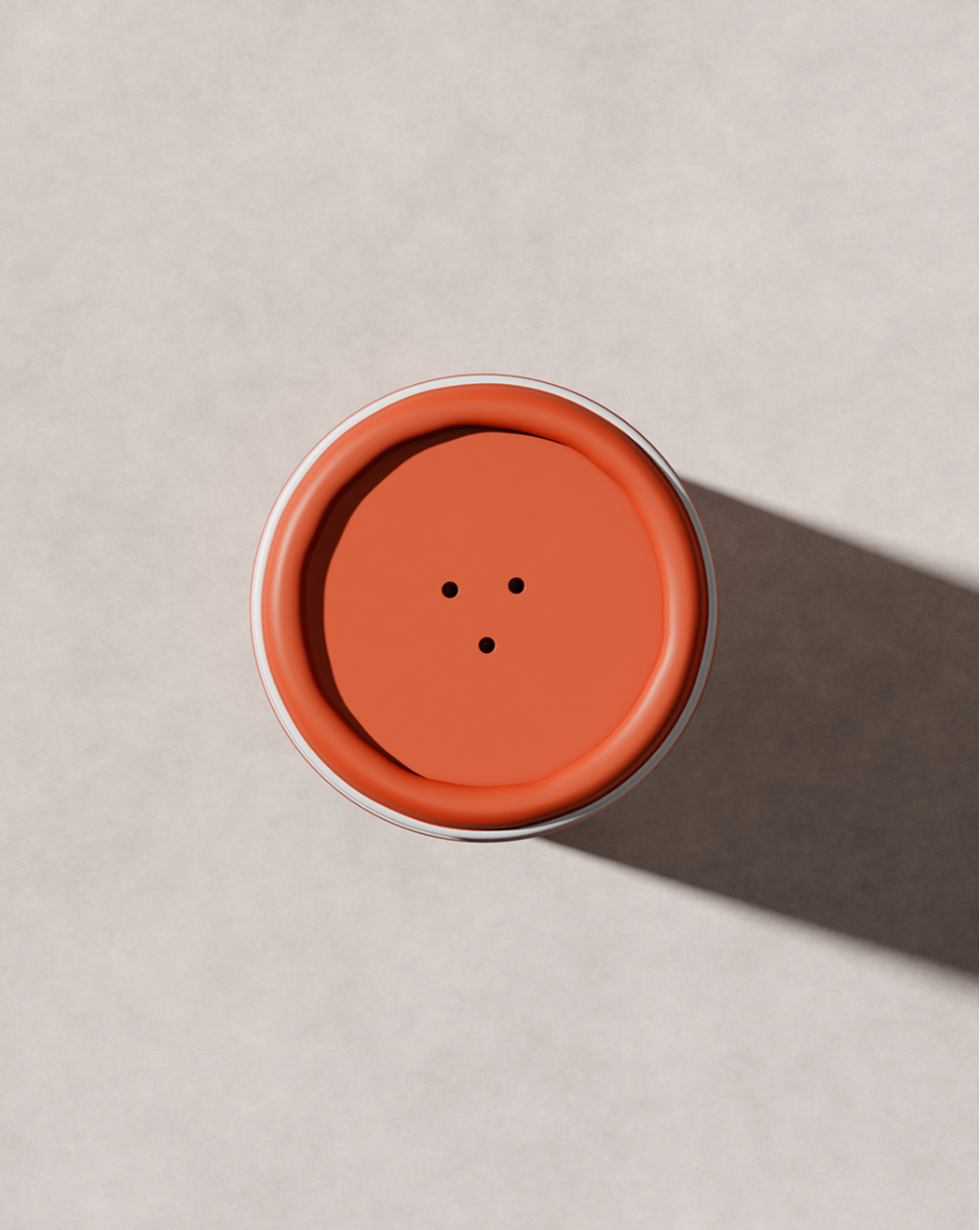 Close-up of Blu & Green Dry Shampoo orange shaker cap with three dispensing holes, eco-friendly aerosol-free powder.