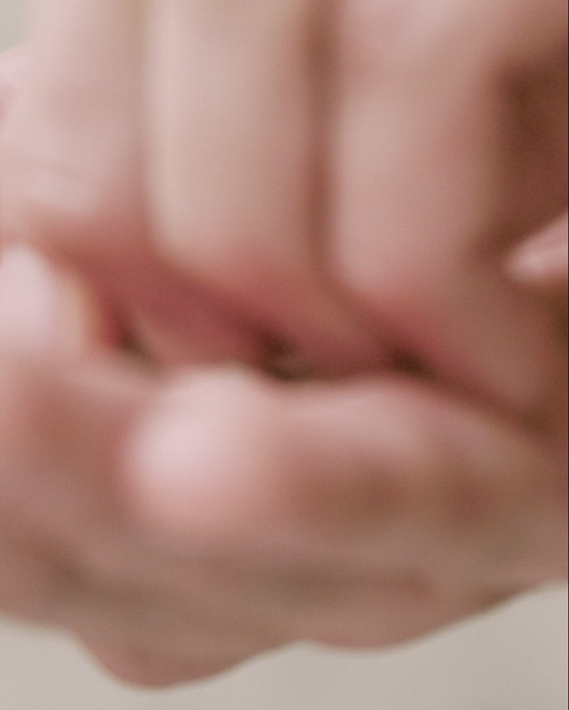 man demonstrates how to use blu and green shampoo tablets by crumbling a tablet to make lather. applying lather to hair. rinsing. marble shower.
