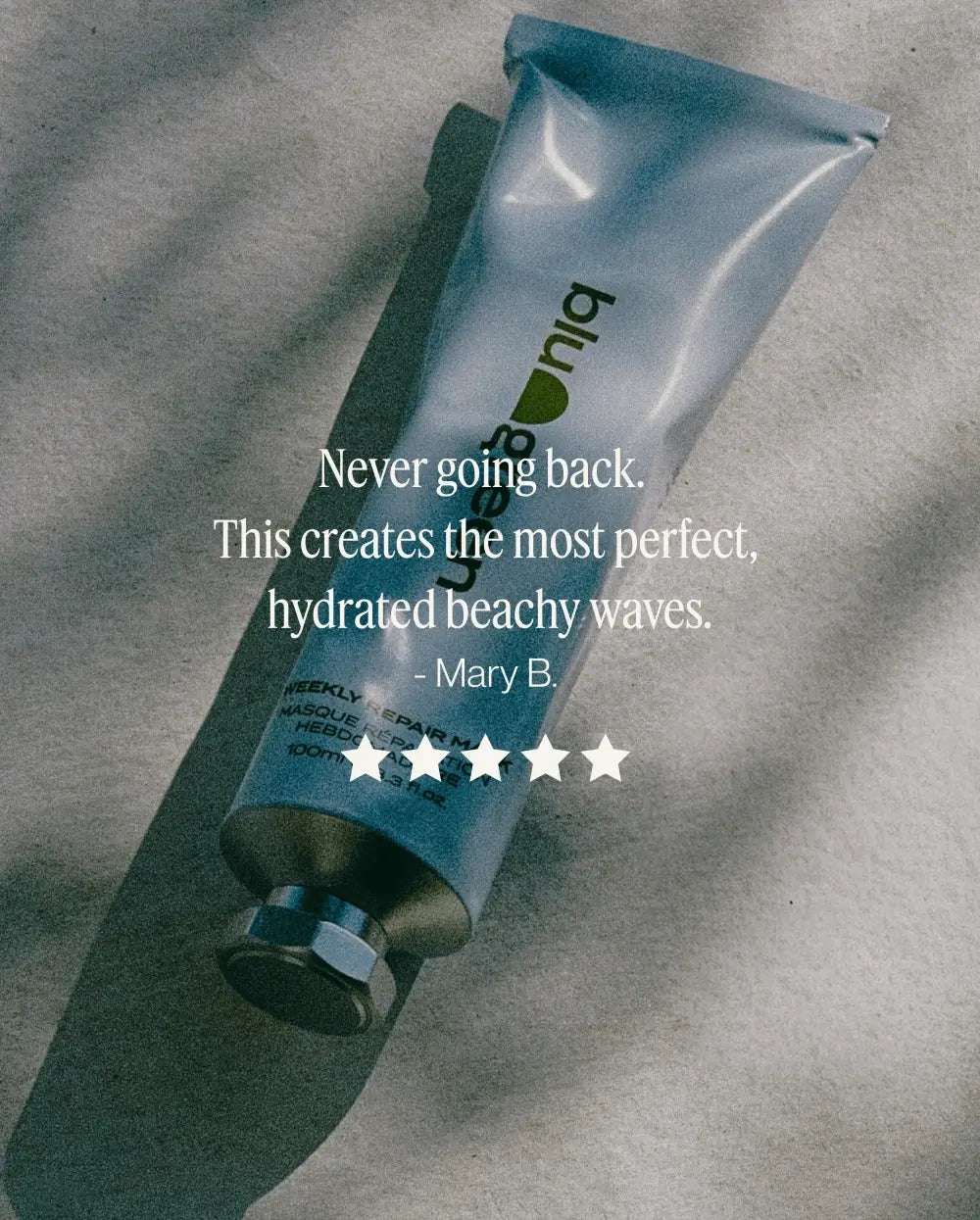 Customer review graphic featuring a five-star rating for Blu & Green Weekly Repair Mask highlighting hydration and beachy wave definition
