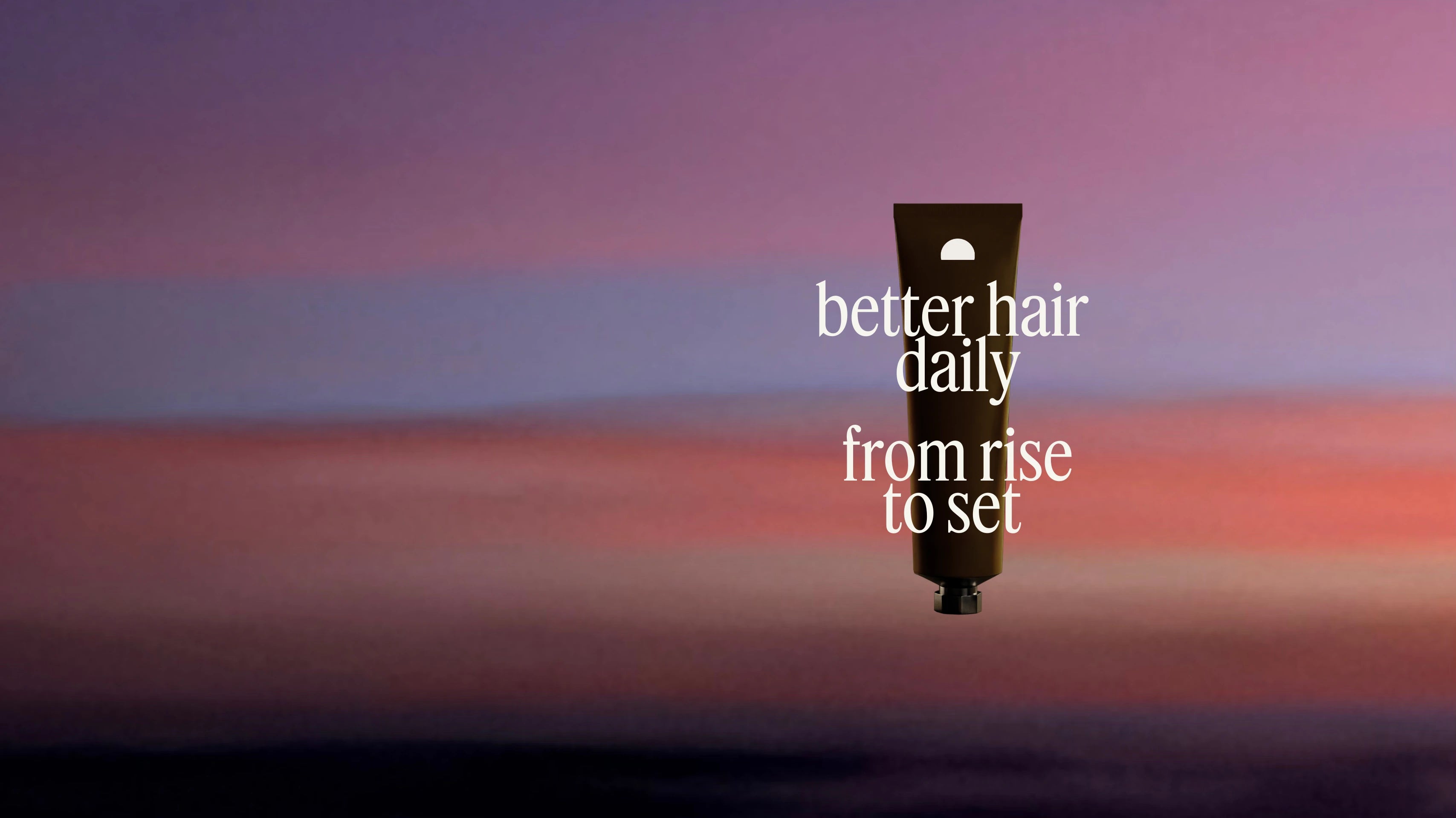A shadowed tube of a hair care product with the text "better hair daily, from rise to set", over a sunset background